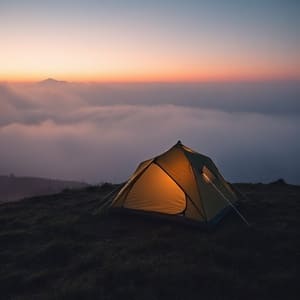 Misty ridge camp at dawn